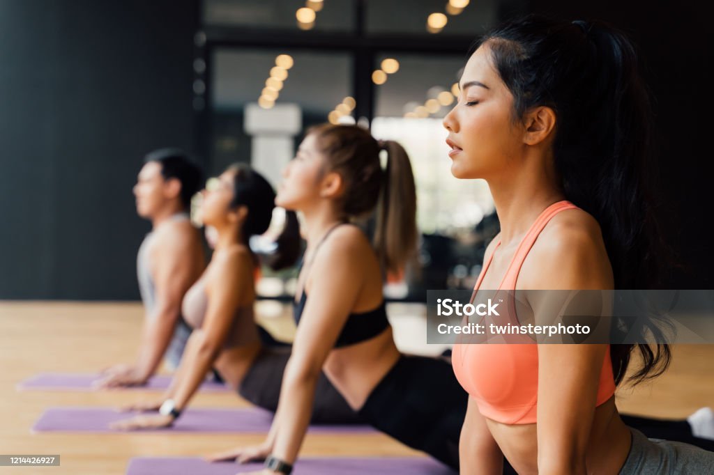 Yoga session in progress, highlighting flexibility and mental well-being. 