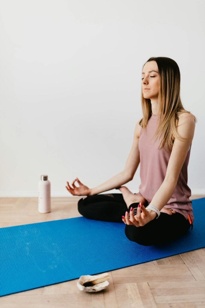 Person practicing yoga for stress management .