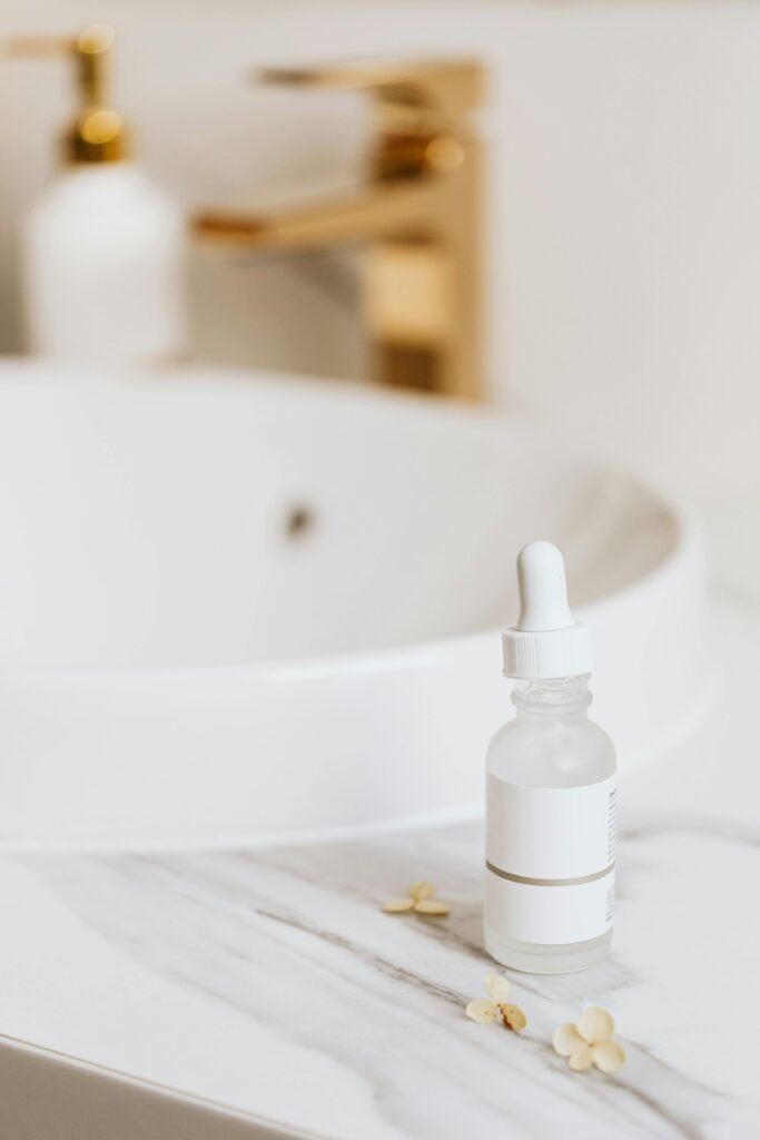 Serum being applied with a dropper, an essential skincare product for targeted treatments.