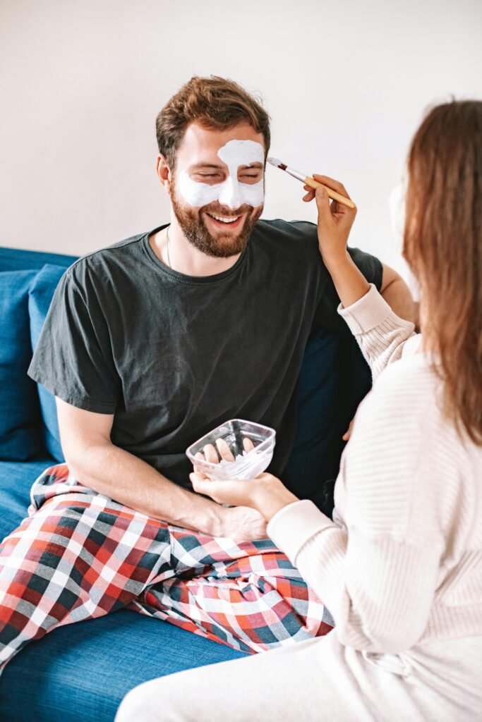 Man using an exfoliating scrub to remove dead skin cells and improve skin texture