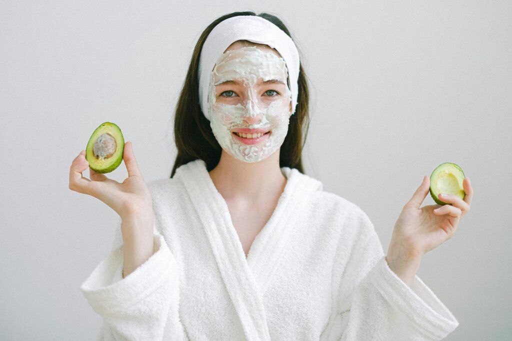 Natural skin care mask ingredients for homemade face masks for healthy skin: avocado and yogurt mixed in a bowl.