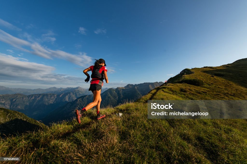 Women rising the hill of a mountain, symbolizing the journey and challenges of fitness motivation. Fitness Motivation Tips.