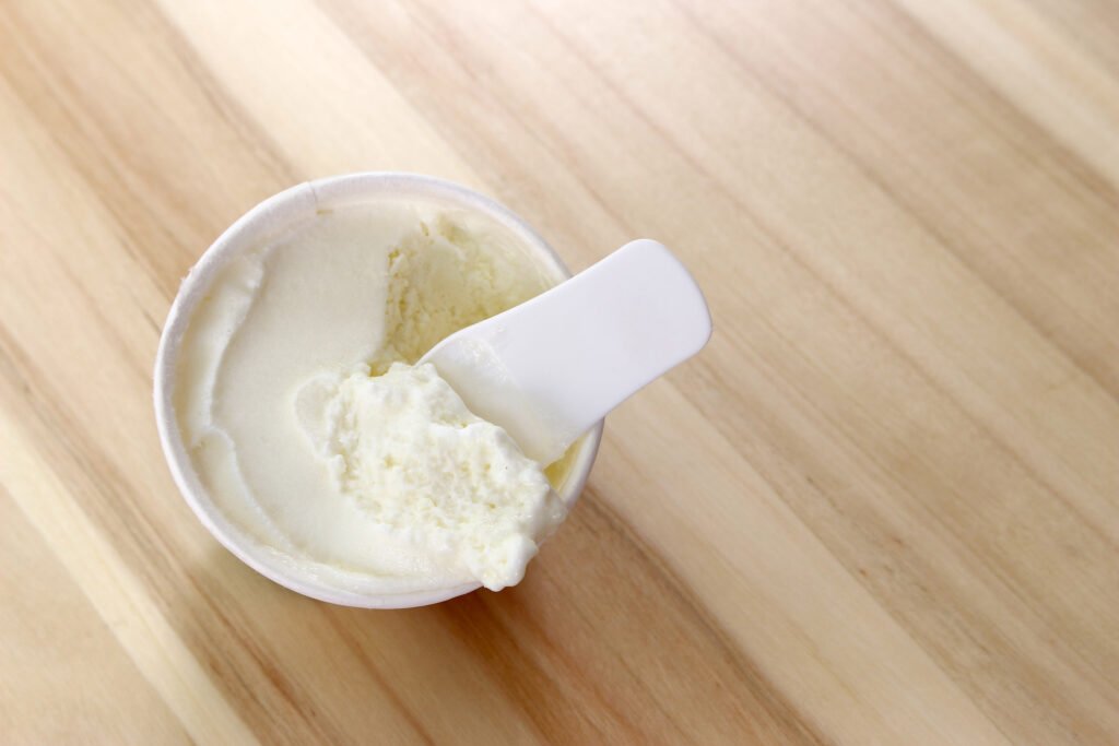 Jar of cupuaçu butter with scoop, emphasizing its use in Brazilian skincare.