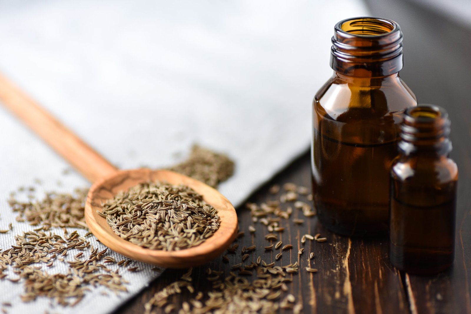 Caraway seeds and caraway seed essential oil showcasing their health benefits.